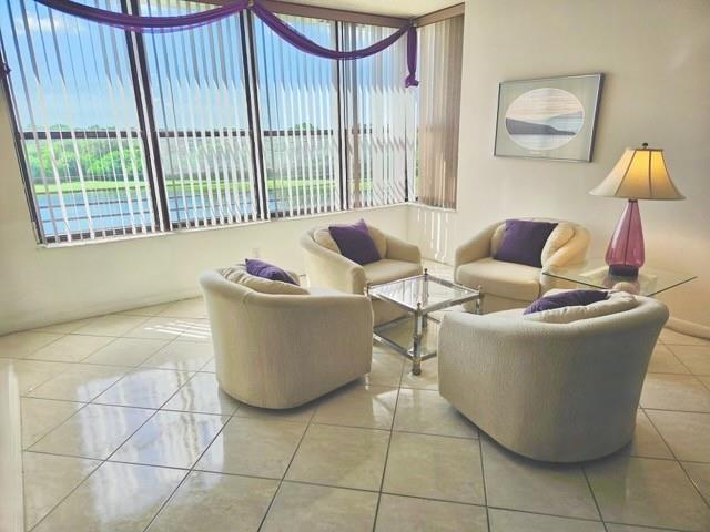 This Condo Home has the most spectacular Lake & Preserve Viewl* Best value for this spacious model *Penthouse condo w/Tile floors, in main living areas*Full size washer & dryer in large laundry room*Main living area includes a sitting room to enjoy the beautiful Lake and Preserve view and early Morning Sunrise through the wall of windows. Large Primary bedroom with attached bathroom* Walk in Shower* Spacious walk in closet plus lots of other closets throughout this home* Great parking Space directly in front of building* Easy walk to heated Community Pool and clubhouse* Community AMENITIES include Olympic style swimming pool, Fitness center, Tennis courts, Walking Paths, Clubhouse w/ card rooms, workshop, Dance & exercise classes* Kids games & swim classes* Play areas and so much more*