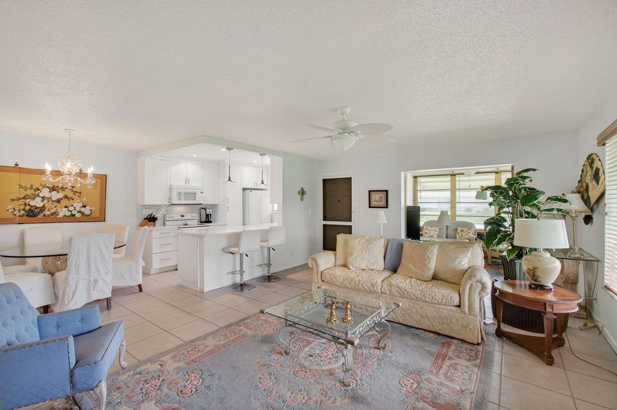 Beautifully updated, 2BR/2BA corner villa in the highly sought-after 55+ community of High Point. Walk to the pool and clubhouse directly across the street. This bright and airy home features an open-concept kitchen with quartz countertops, LED recessed lighting, pots and pans drawers with soft close hardware, built-in pantry, plus a spacious Florida room under air, tile flooring throughout and a private backyard patio perfect for BBQs. AC was replaced in 2020 and WH 2019. Community amenities include a large, heated resort-style pool, active clubhouse with planned social events, and included water, cable, and internet.  ROOF ASSESSMENT WAS ALREADY PAID. Can be rented after 2 years of ownership. Live the Florida lifestyle. All information is deemed reliable but not guaranteed.