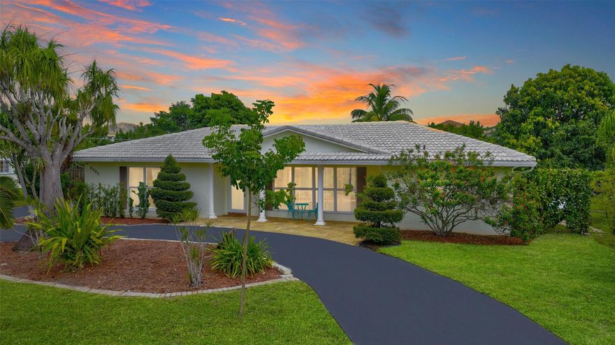 Coral Springs gem! This immaculate single-story pool home boasts soaring vaulted ceilings, hardwood floors, and designer lighting. The open layout flows seamlessly to a private backyard oasis w/ sparkling pool and lush landscaping. Marble-appointed baths and flexible bonus space add value. Located in highly sought-after Coral Springs near The Walk shopping center, A-rated schools, and beautiful parks like Mullins Park. Perfect for families or investors seeking a prime location w/ strong rental demand. This turnkey property combines luxury living w/ the convenience of Coral Springs' acclaimed amenities! Good luck and stay friendly!