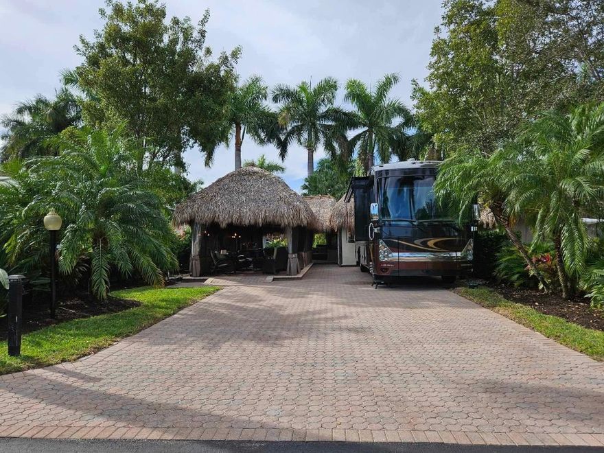 Own your slice of paradise at Aztec RV Resort, a luxurious Class A motorcoach community offering a vibrant lifestyle and top-tier amenities including a resort style pool, family pool, pickleball/tennis courts, a state-of-the-art fitness center, volleyball court, and plenty of activities during season.  This gated, all-ages resort provides easy access to Fort Lauderdale beaches, the international airport, premier dining, and entertainment. The property features a private tiki with kitchen, dining, and sitting areas—perfect for relaxing or entertaining—plus a charming casita with a full bathroom and Murphy bed for guests or extra comfort. Get the life you deserve and enjoy resort-style living at its finest.