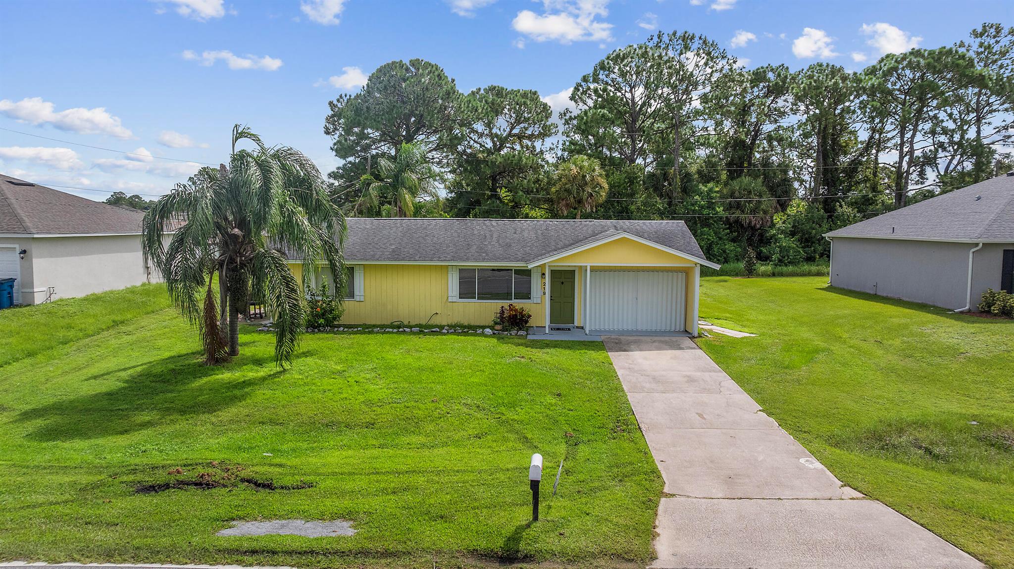 219 Eldron Boulevard SE, Palm Bay, FL 32909 - This 2 bedroom (WITH EXTRA DEN SPACE), 1 bathroom single-family home offers 1,098 square feet of living space on a 0.23-acre lot in the Port Malabar community. The home features an open floor plan with tile flooring throughout, skylights for natural light, and a renovated functional kitchen with breakfast bar. Additional highlights include a gorgeous renovated bathroom, patio, and spacious yard. Conveniently located near local schools, shopping, and parks, this property presents an excellent opportunity for first-time buyers or investors.