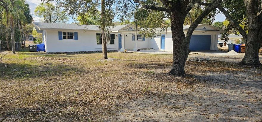 Updated 5 bedroom/2 bath home, 2 car garage, Large 1/3 Acre Lot with lots of shade in front, NO HOA, Room for boat, RV, work truck, extra parking. Amazing location near everything, Approx. 2200sf of living space. New kitchen, flooring, etc... Separate laundry room. Large shed/workshop in the back yard with plugs and lighting. Public water supply. Newer roof and a/c. Close to Vero Beach Airport and the beach. The septic system is working but it will be replaced prior to the closing. Finishing touches still being completed by the owner.