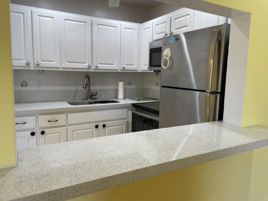 Photo of 2960 Lake Osborne Drive #107, Lake Worth Beach, FL 33461 (MLS # B26023904)