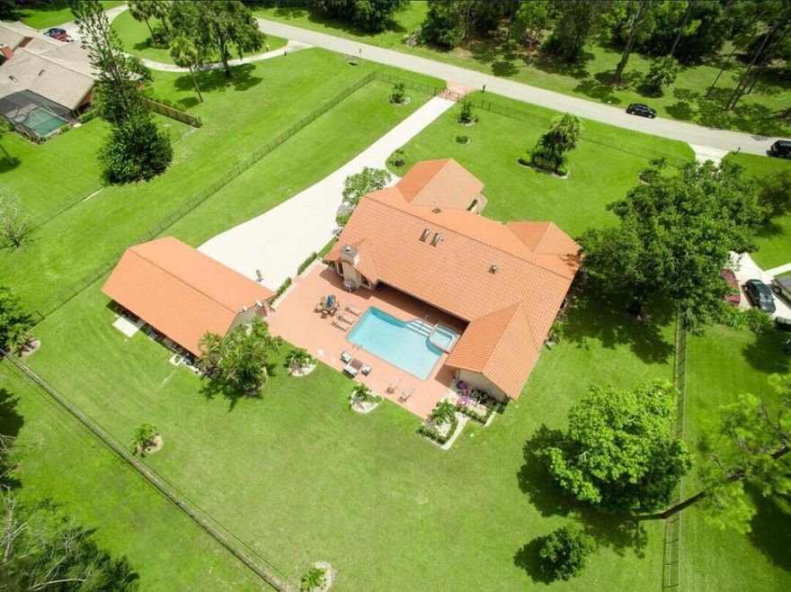 Experience upscale living in the heart of Wellington with this exceptional annual rental. This elegant courtyard-style home features a main residence with 4 spacious bedrooms and 3 beautifully appointed bathrooms, along with a separate guest house offering 2 bedrooms and 1 bath. Enjoy a private pool and expansive deck—perfect for relaxing or entertaining—set on a full acre of land. The property also includes a large, securely fenced yard, ideal for pets. A perfect blend of luxury, comfort, and space awaits.