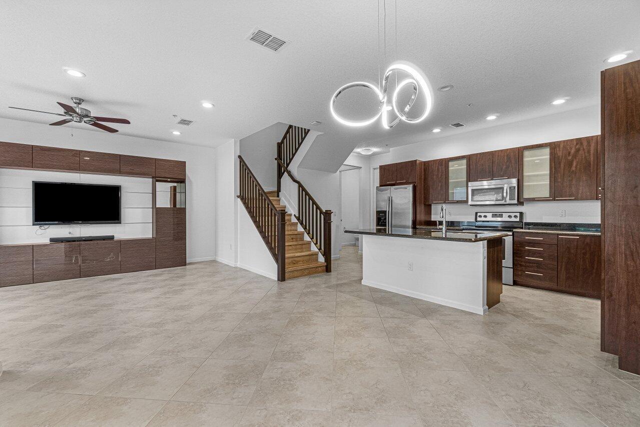 Here we have an updated 3 bedroom 2.5 bath townhome in the luxurious Centra community of Boca Raton. This spacious home features ten-foot ceilings, granite counter tops, stainless steel appliances, dual sinks in main and guest bath, 2 car garage, plenty of storage, high-hat lighting, waterfront jogging/walking path and more. The Centra Community offers a large clubhouse, heated pool, fitness center, playground, gated entry and security patrol. This location is close to I-95, Mizner Park, Town Center Mall, Fresh Market, FAU, and Lynn University. Also only a short 8 minute drive to the beach! Easy viewing and ready for your enjoyment. See it - Live it - Love it!