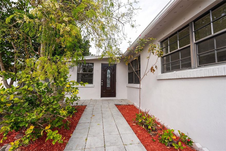 Come feel this well-maintained, spacious 3 bed/2 bath home featuring a private-entry bonus suite with full bathroom on a oversized 0.17-Acre Lot! Perfect for guests, multigenerational living, or flexible use. The main home offers comfortable living spaces and a functional layout, while the additional suite is accessed through the patio and provides added privacy. This property offers plenty of outdoor space with room to entertain, relax or customize your lifestyle! Conveniently located with ease of access to I-95 & Florida Turnpike, near shopping and dining - a unique opportunity with versatile living options! Some photos have been virtually staged to show design potential.