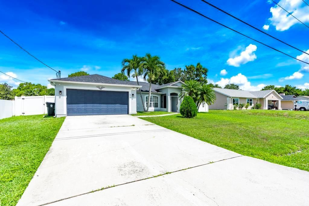 Photo of 573 SW Cherryhill Road, Port Saint Lucie, FL 34953 (MLS # R11101833)