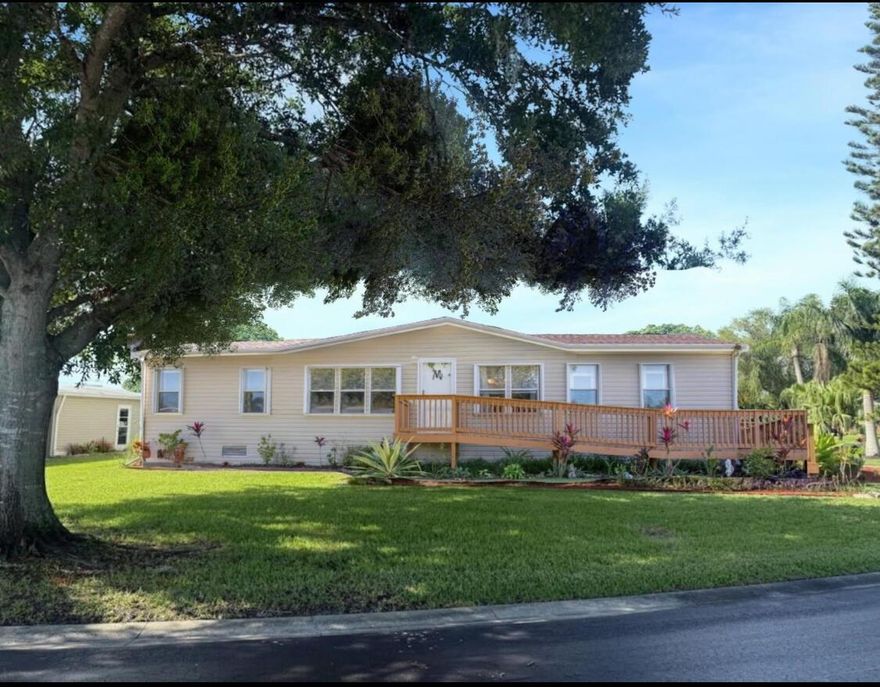 SEMINOLE COVE 3/2 DWMH on corner lot with captive lake view. Newer roof, new HVAC! Open concept, breakfast bar, spacious living and dining, walk-in closets, master features garden tub and separate step-in shower. Freshly painted interior and lvp flooring and tons of storage. Screened in patio perfect for bbqs and sunsets. Attached carport, ramp, and workshop. Home comes partially furnished and complete with storm panels. Public water and sewer. 55+ Community offering heated pool, clubhouse, fish cleaning station, and activities. Priced to sell!Measurements are approximate.