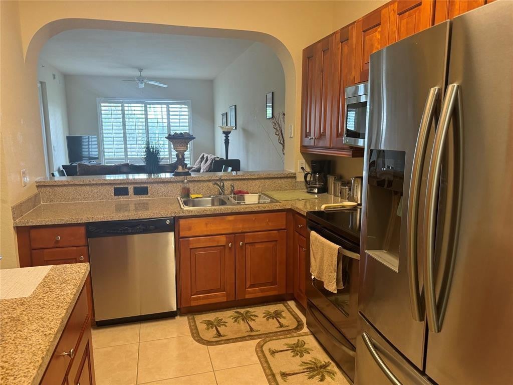 Photo of 3500 OAKS CLUBHOUSE Drive #204, Pompano Beach, FL 33069 (MLS # B26083104)