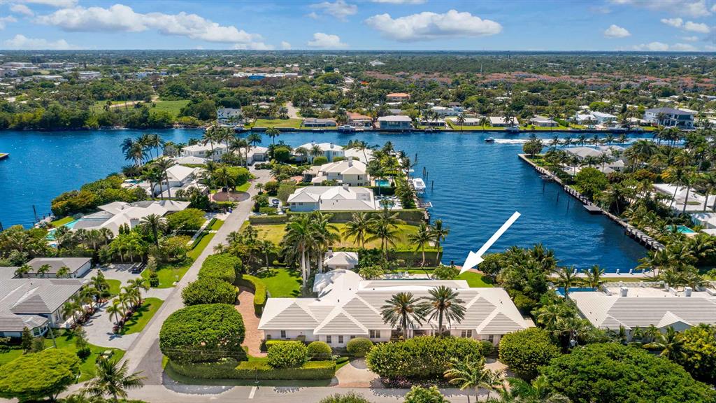 The waterfront estate at 525 Middle Rd, Gulf Stream offers the perfect setting for festive entertaining and private retreats alike with lovely grounds and water views. The residence is situated on over two-thirds of an acre with frontage on Polo Dr and Middle Rd. Designed by William Wietsma, the custom-built home features a great floor plan for privacy with formal living and dining room, spacious kitchen and family room, den, master wing plus three en suite guest rooms, exercise room, three car plus golf cart bay garage, and incredible loggia, pool and cabana with summer kitchen and bath. Boaters will appreciate the waterfrontage with dock and easy access to the ocean via nearby inlet. Close to Delray Beach and Palm Beach, this luxurious home is offered furnished and sure to please.
