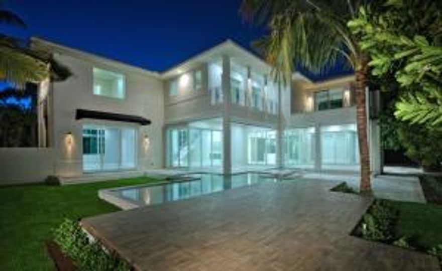 Experience the Ultimate…New Luxury Modern Dream Home in Delray Beach.
Upon entry, this newly constructed residence elegantly articulates the ideals of classic modern style. Designed by Randall Stofft and impeccably finished by Interior Design South using a diverse array of natural materials and textures, the home features a gracious layout.  The two story residence totals 6,500 t/-  sq ft,  with four bedrooms, six bathrooms, a first floor club room, second floor loft space and a sumptuous second floor owner’s suite complete with a large outdoor terrace and fireplace affording a perfect retreat for a cool Florida evening. Evoking a warm feeling of belonging, the sleek vertical lines of the living room reveal a stunning architectural stone wall, bioethanol fireplace and floor to ceiling glass pocket doors which open to a resort styled pool and dual covered loggias. A cutting edge Italian kitchen includes refrigerated wine storage, custom designed island, and a dining and relaxation zone that function as the social hub of the house. Contemporary design features include rare marbles and wood floors, impact windows, automatic Phantom loggia screens, smart home functions, dual laundry rooms, and an open glass wall system that seamlessly provides fresh breezes and streaming light.  Complementing the iconic design, the Zen like pool with spa, sun shelves and swim bench encompass the perfect Florida lifestyle and take outdoor entertaining to a new level.  Quite simply, the home expresses pure perfection. Close proximity to the beautiful Atlantic Ocean and a wealth of luxuries and conveniences found on Atlantic Avenue.