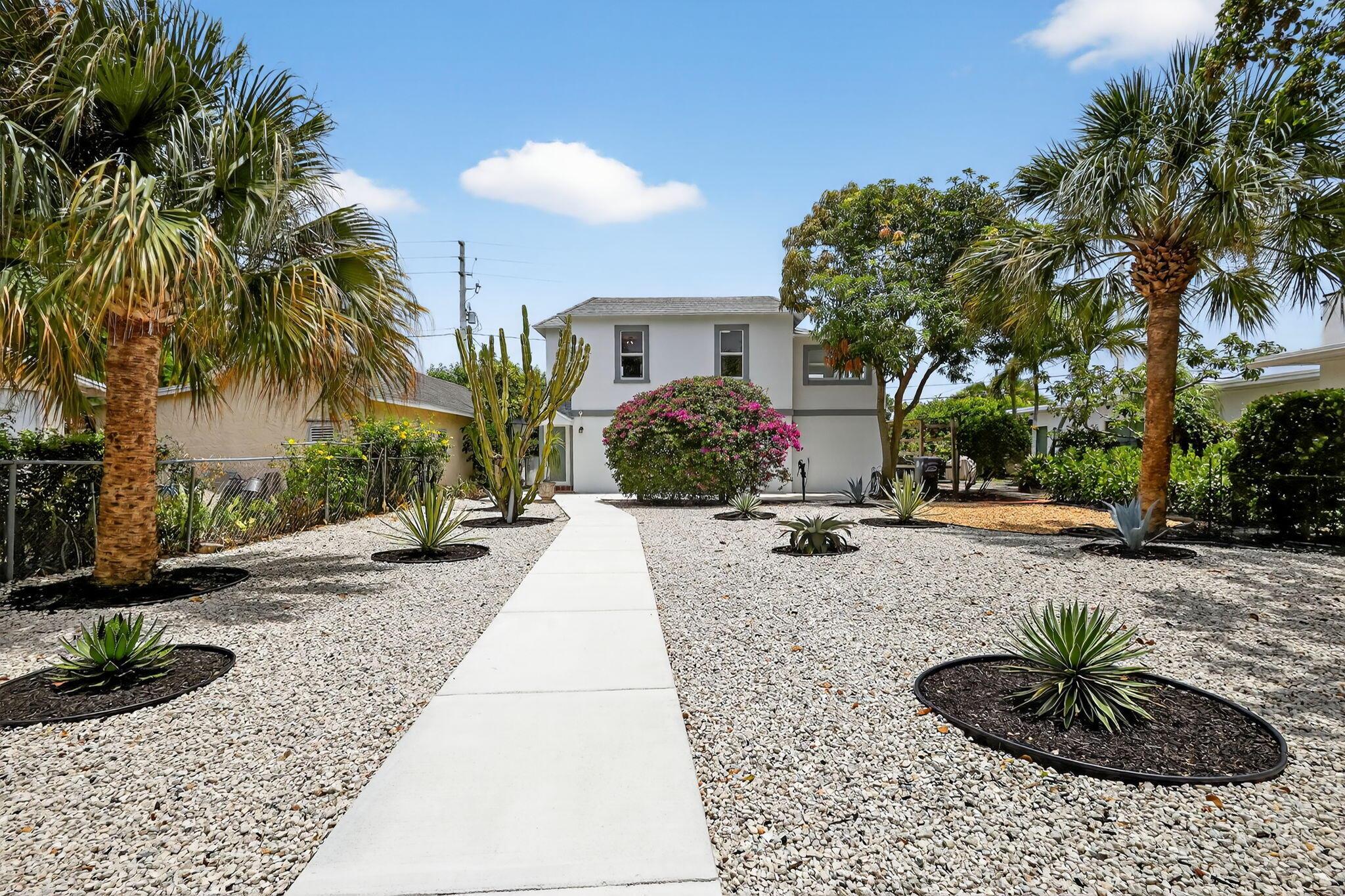 Beautifully updated, unfurnished 2-bedroom, 1-bath home in prime West Palm Beach. The bright upstairs living area features wood floors and impact windows, while downstairs offers a large storage room plus two single garages--one perfect for a car, the other for a bike, golf cart, or workshop. Freshly remodeled with a full kitchen, modern appliances, on-site washer/dryer combo, and central A/C. Spacious front yard ideal for pets or entertaining (one pet under 25 lbs considered). 12-month lease available now with first month's rent and security deposit. No smoking. Landscaping included. Steps from Antique Row and minutes from downtown, the beach, I-95, shopping, dining, and WPB Airport.