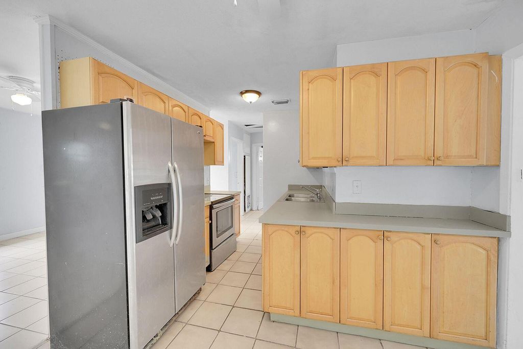 Photo of 1645 W 31st Street, Riviera Beach, FL 33404 (MLS # B26014760)