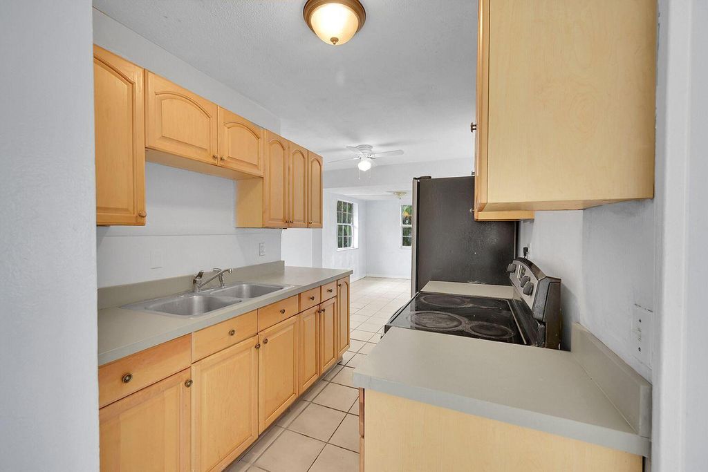 Photo of 1645 W 31st Street, Riviera Beach, FL 33404 (MLS # B26014760)