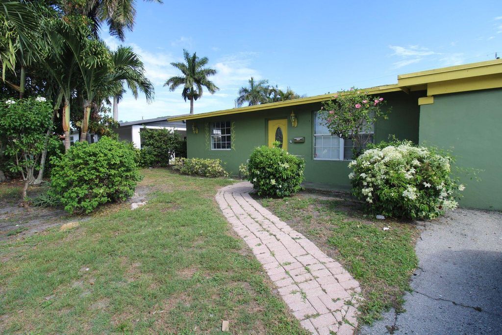 Photo of 1645 W 31st Street, Riviera Beach, FL 33404 (MLS # B26014760)