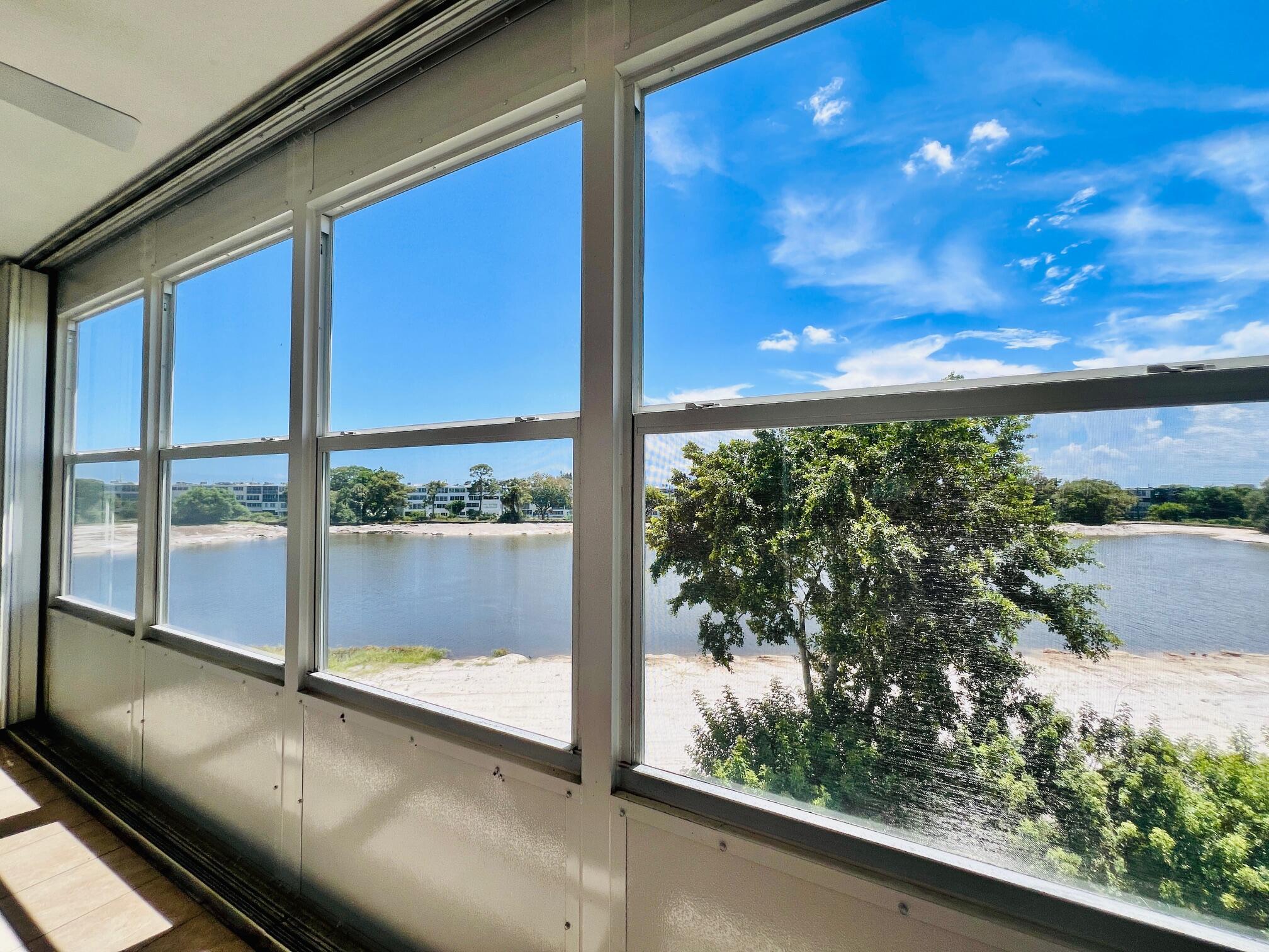 WOW WITH NEW WATER VIEWS IN 55+ CENTURY VILLAGE! Phenomenal Corner Unit Opportunity With Gorgeous New WATER VIEWS From Your Dining Area, Kitchen, and Lanai! The Luxury Greenbrier Section 2/2 Floor Plan is the Largest in Century Village. Lovingly Enjoyed & Maintained W/ Updated Enclosed Lanai, New Central AC (8/2023), and Full Hurricane Protection With Shutters All Around. The Greenbrier B Building Will Enjoy, Once Complete, Water & Green Space Views of the Reflection Bay Community! Greenbrier B Is A Well Managed Luxury Building W/ New Roof (2021), Elevator, Trash Chutes, Extra Storage, Reserves, and Access to the Private Pool for Greenbrier Residents! Century Village Is A Vibrant 55+ Community Centrally Located In Highly Desirable Palm Beach County! Enjoy Resort Style Amenities...