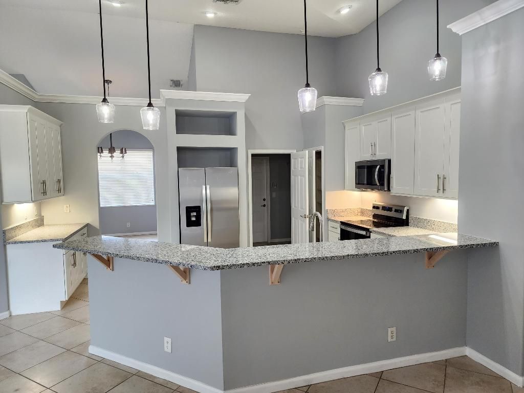 Photo of 3697 SW Rosardo Street, Port Saint Lucie, FL 34953 (MLS # R10976078)