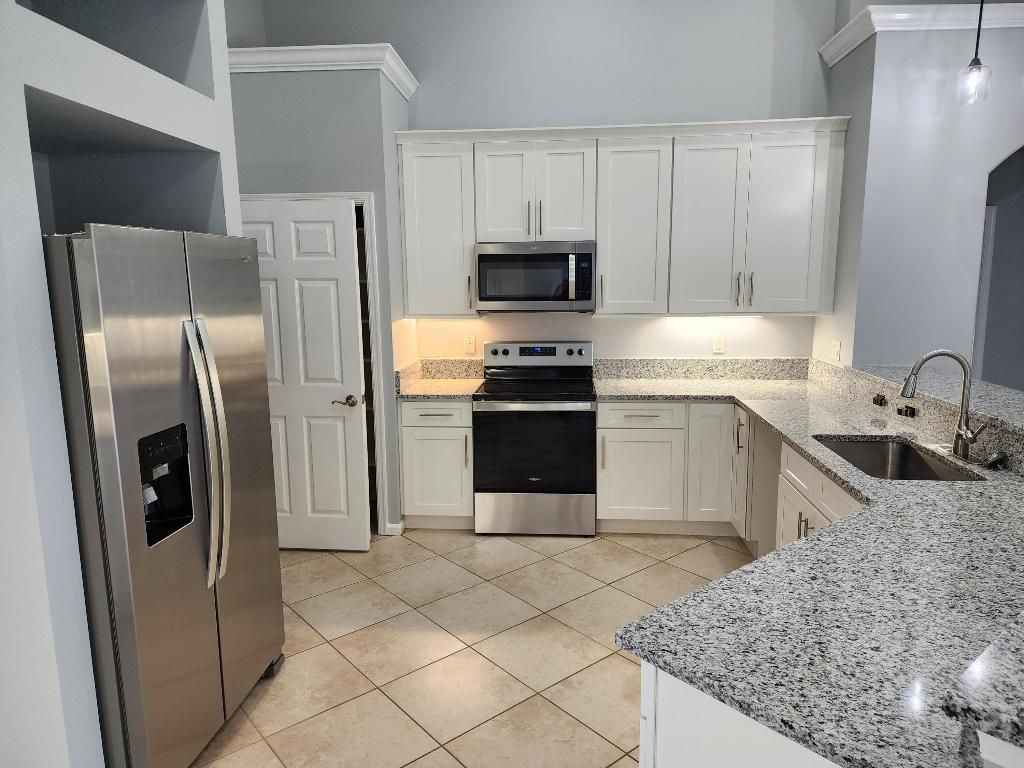 Photo of 3697 SW Rosardo Street, Port Saint Lucie, FL 34953 (MLS # R10976078)