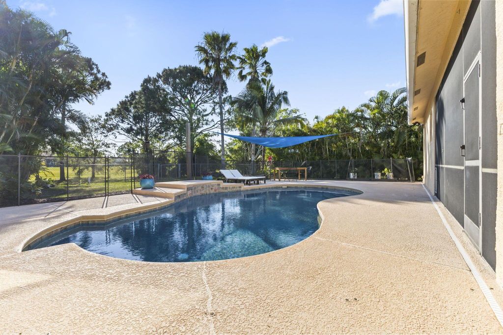 Photo of 5898 NW Dowse Street, Port Saint Lucie, FL 34986 (MLS # R11083299)