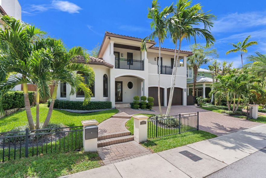 Located In Historic Rio Vista, This 2015-Built Home Blends Elegance And Modern Design With Lush Tropical Landscaping And An Open-Concept Layout. The Chef's Kitchen Features Gas Cooking, Double Ovens, Custom Cabinetry, Center Island, Wine Cooler, And Counter Seating. The Primary Suite Offers Dual Closets And A Spa-Style Bath With Soaking Tub And Separate Shower. First-Floor Office/Guest Suite Adds Flexibility. Porcelain Floors Downstairs; Hardwood Upstairs With Two Oversized Bedrooms, Jack-And-Jill Bath, And Balcony With Skyline Views. Impact Windows/Doors, Volume Ceilings, And A Private Fenced Yard With Natural Gas Summer Kitchen. Prime Location Near Downtown, Las Olas, Beaches, And Airport.