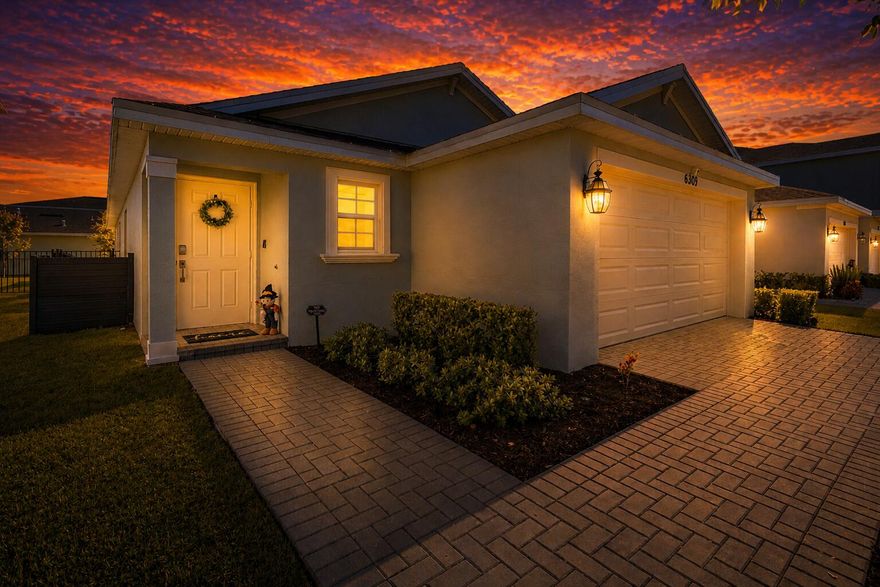 This new single-story home features a smart layout designed for ease-of-living and entertainment. An open-concept layout connects the well-equipped kitchen featuring Quartz countertops, stainless appliances, under-mount island lighting, beautiful shaker cabinets, breakfast nook and family room, which extends to the terrace for outdoor moments. On the opposite side of the home are two secondary bedrooms and a spacious owner's suite with a full-sized bathroom with dual sinks and tiled showers. At the front is a convenient two-car garage with pavered driveway, extended paver back patio, enclosed & screened in rear porch, and fenced in yard for privacy. Lovely lake views to the southeast, walking distance to the clubhouse and amenities, and GAS stove, GAS tankless water heater, GAS dryer!!!