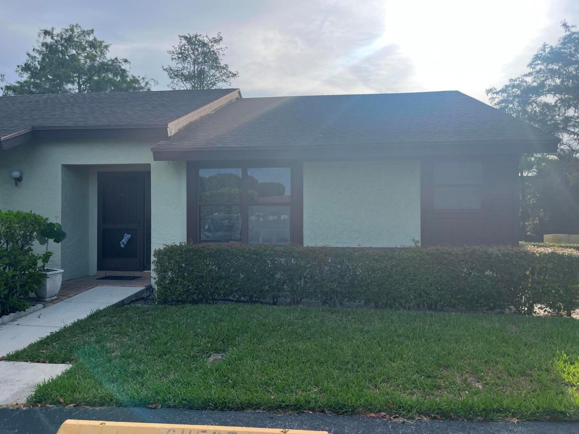 Not available until 7/15/2024, renovation are not complete but still available to show. This 3-bedroom, 2-bathroom corner unit villa is located in a desirable 55+ community. Recently painted, updated kitchen, and flooring. This well-maintained home offers a peaceful lifestyle with access to community amenities and a convenient location close to shopping, dining, and more. Less than 10 minutes away is Royal Palm Beach Commons Park with activities that include amphitheater with concerts, driving range, disc golf, and more. The Village of Royal Palm Beach Recreation Center offers many senior activities including Pickleball, Silver Sneakers, Tai Chi, Technology Classes, Book Club, Young At Heart, and other activities. Call today for your private showing.