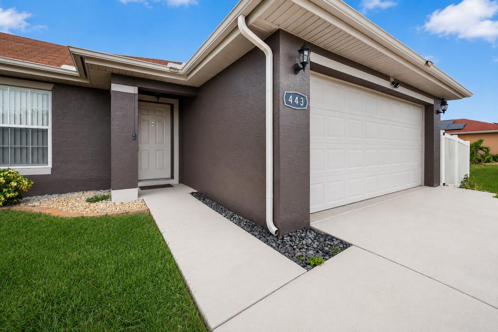 Photo of 443 SW Homeland Road, Port Saint Lucie, FL 34953 (MLS # B26059023)