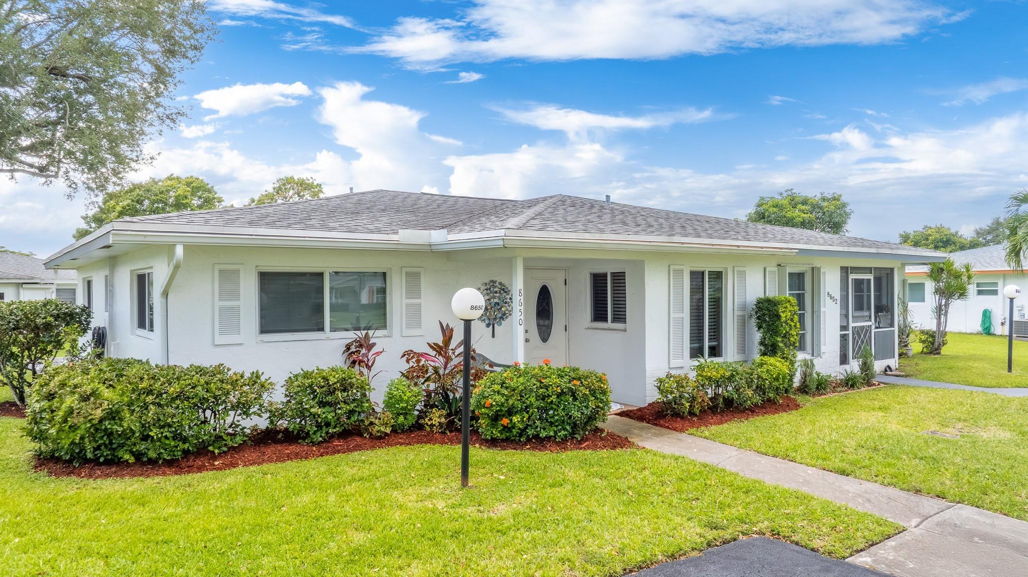 LAUDERDALE WEST, 55+ Prestigious Community, 2/2 duplex. Gorgeous move-in-ready home w/incredible, completely remodeled eat in kitchen w/granite counter tops, updated 2 full baths, all tile thru-out, hi hat lights, oversized rear patio overlooking expansive green lawn, deep driveway accommodates at least 4 cars, w/d in unit, shows like a model home. Furnishings negotiable. Maintenance fee includes Fiber Optic HD TV & Internet, courtesy bus at your door, lawn service, repair/replace roof, exterior painting, clubhouse, 2 pools, Tennis courts, pool tables, Ping Pong, card rooms, professional shows, library, fitness center and much more. Close to shopping and restaurants. 20% down, 720 credit score please.