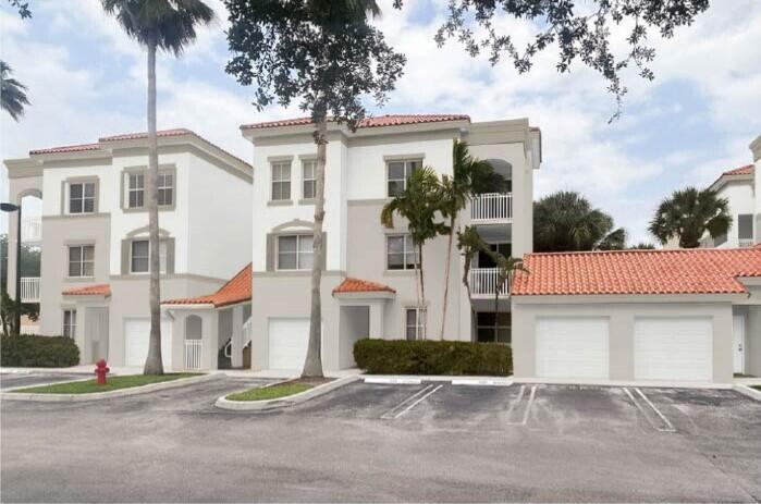 Beautifully updated 1 bed/ 1 bath in this luxury gated community in the heart of Palm Beach Gardens. Remodeled top floor unit with lake views. Features; new custom window treatments, new fans, large walk in closet, an open kitchen with white cabinets, new s/s appliances, smart range that features air fry and convection. New natural stone counter tops, full-size washer/dryer, custom vinyl flooring throughout and a completely remodeled bathroom. Enjoy lake views from your private balcony. Addt'l features; Resort style amenities, community pool, fitness center, tennis courts and clubhouse. Walking distance to shops and restaurants and conveniently located near the Gardens Mall and I-95. One assigned parking space; water included. Pets welcome.