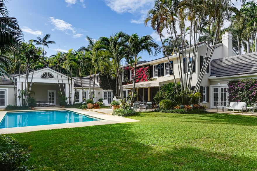 Sited on one of the prettiest streets in Palm Beach, this elegant traditional residence embodies the perfect home to enjoy a Palm Beach lifestyle. There is a seamless flow from the indoor spaces to the lush outdoor spaces. This 4 bedroom, 5.5 bath home is private and secluded. Enter into a large foyer with a dramatic staircase, flowing into to a formal living room with a fireplace.There is an adjoining sun-filled family room with a cathedral ceiling and French doors opening to the garden. The large master suite is a refuge with its own private sitting room. The generous sized rooms also include a cozy paneled library/office, formal dining room with bay window, and breakfast room. The loggia overlooks a large pool and two covered outdoor dining areas. The large lot is 140 x 165.