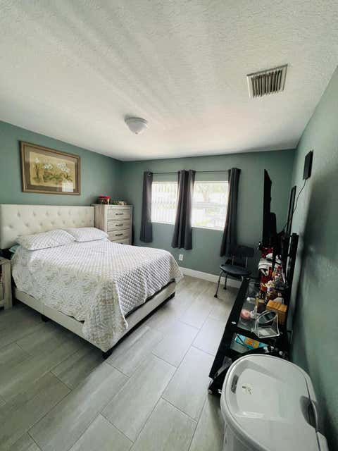 Tiny photo for 8719 N Ashley Street, Tampa, FL 33604 (MLS # B26036237)