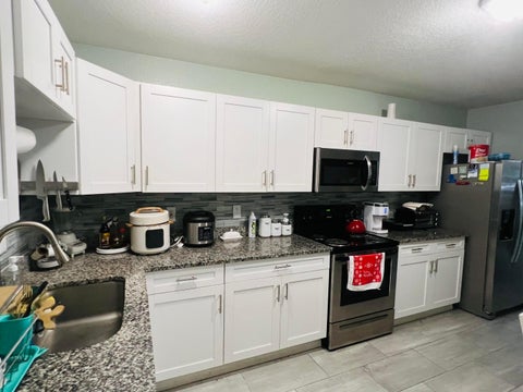 Tiny photo for 8719 N Ashley Street, Tampa, FL 33604 (MLS # B26036237)