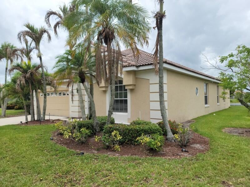 Photo of 895 SW Lake Charles Circle, Port Saint Lucie, FL 34986 (MLS # B26043800)