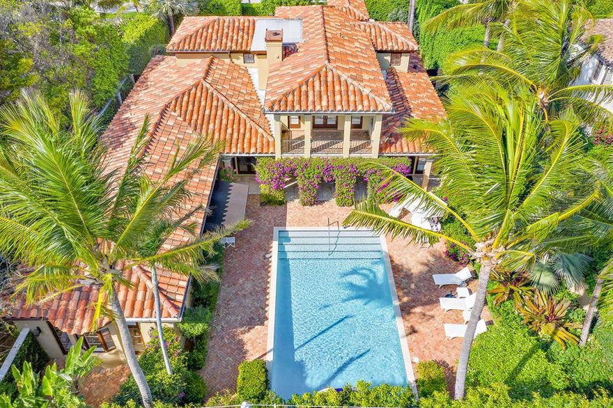 Capture the sea breezes from this exceptional Mediterranean villa located on the desirable ocean block of Brazilian Avenue. This well-appointed meticulously maintained home has an intuitive layout with generous room sizes and an ideal floor plan. Highlights include inviting entertainment spaces, a large first floor master bedroom suite with double baths and closets, library/den, media/play room, office and an eat in kitchen with butler's pantry and French doors that open to the lanai and pool from all main rooms. The property is fully hedged for privacy with lushly landscaped grounds and has a sun drenched serene backyard with large pool and spa. Situated just four houses from the beach yet right around the corner from Palm Beach's finest shops, restaurants, galleries and clubs.