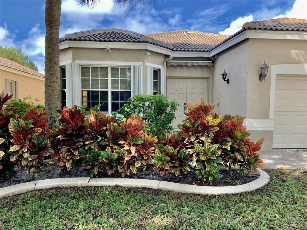 Photo of 5737 NW 49th Lane, Coconut Creek, FL 33073 (MLS # B26017205)