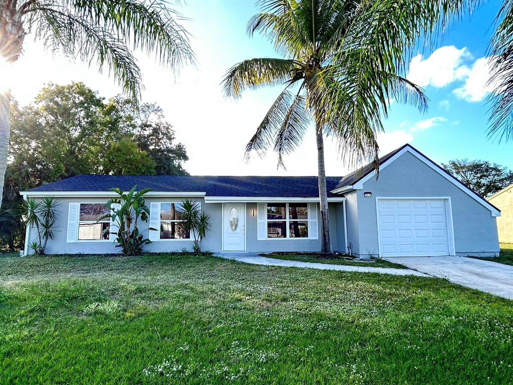 Photo of 317 SW Kentwood Road, Port Saint Lucie, FL 34953 (MLS # R11063723)