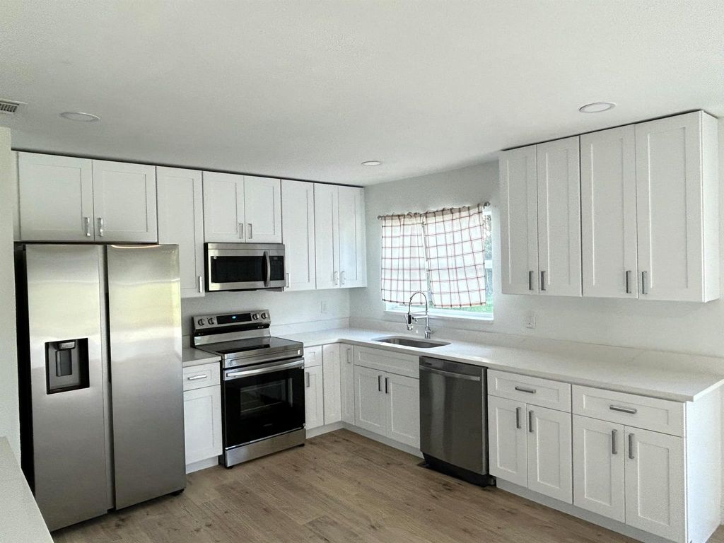 Photo of 317 SW Kentwood Road, Port Saint Lucie, FL 34953 (MLS # R11063723)