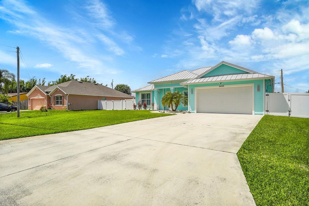 Photo of 2420 SE Rock Springs Drive, Port Saint Lucie, FL 34952 (MLS # R11078628)