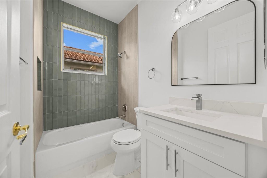 Photo of 7558 Tarpon Cove Circle, Greenacres, FL 33467 (MLS # B26005089)