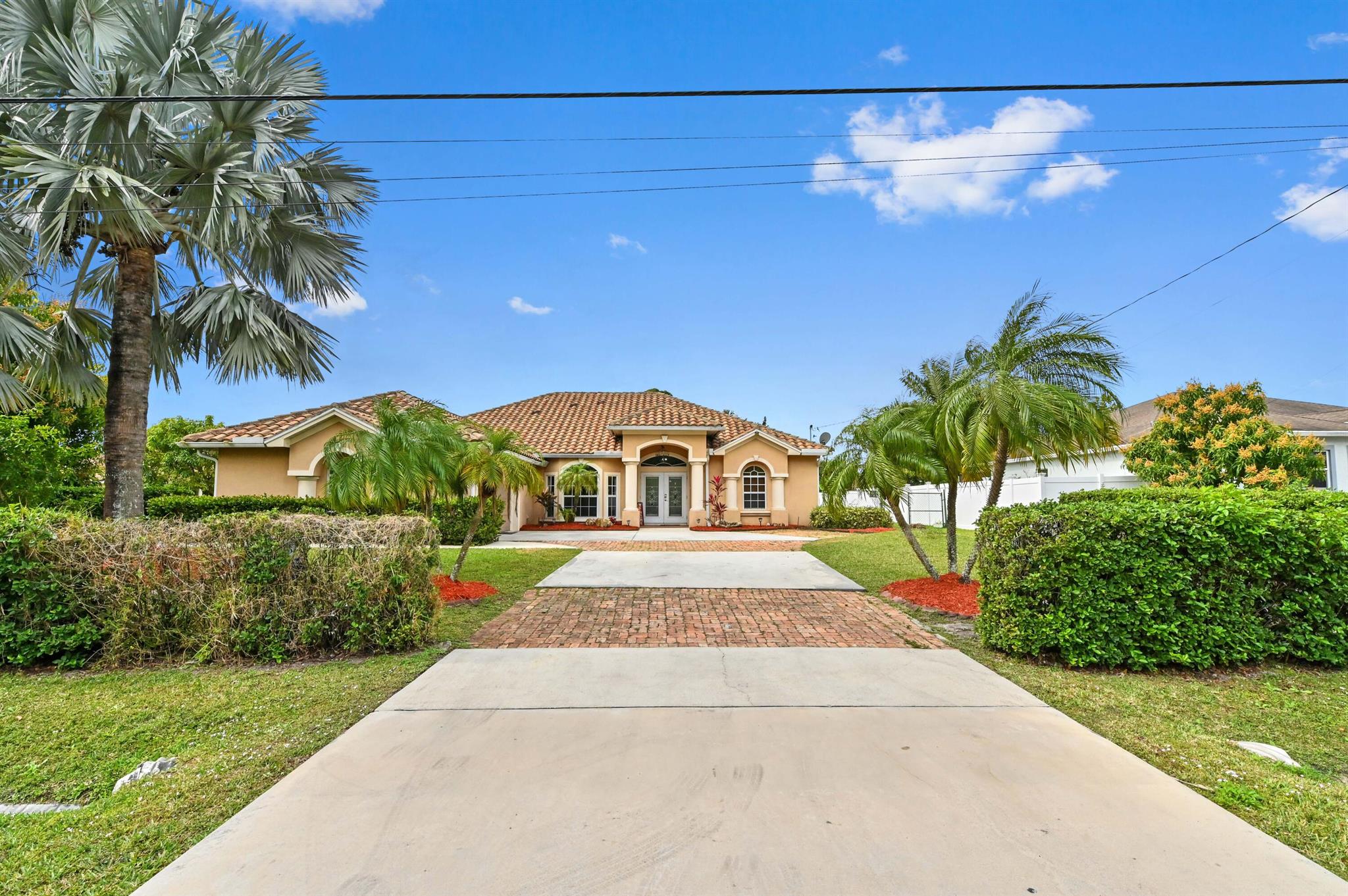 This beautiful updated open concept 3 bedroom 2 bath home with heated pool. Enter into the large living area . The kitchen comes granite countertop, an island, and all stainless appliances with beautiful dark wood cabinets. Each bedrooms have hardwood laminate with walk in closets and have built-ins. Master has his and her closet. The backyard is fully fenced back yard is backed up to a small creek for added privacy and security. Backyard also boast a gazebo area overlooking the screened heated pool with custom rock accents waterfall, a spa, LED lighting. The fully tiled garage can be used as an office, movie room, game room, man cave or kids playroom. Enjoy all this beautiful home has to offer and make it your own.