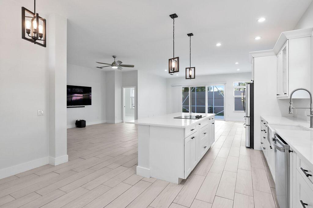 Ready for move-in! BRING OFFERS! Located in the heart of Jupiter in the desirable Hamptons at Maplewood. Tastefully updated and renovated kitchens, floors and primary bath, this 3 Bedroom, 2 Bathroom home with high ceilings is just minutes from shops, restaurants, and golf courses. Open concept layout with a large living area and a split-bedroom floor plan. The spacious primary suite has his/her closets, a separate shower and tub, and double vanity. Southern exposure. Sky lights and large impact windows bring in lots of natural light. No neighbor on one side, but instead a nice natural area. 2-car garage. Nestled on a beautiful tree-lined street that is only minutes from the beach. Internet, cable and front yard landscaping, included in rent. Pets may be considered on a case by case basis