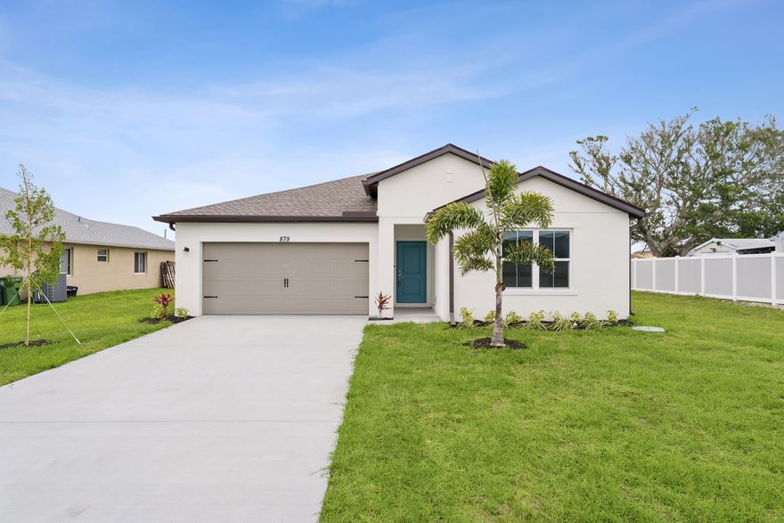 No HOA fees at this beautifully designed Passionflower II home offering 4 bedrooms and 3 bathrooms, including the highly sought-after Extra Suite Plus with a private entrance and attached apartment. This amazing Next-Gen property, located in the heart of Port Saint Lucie, presents a rare opportunity for multi-generational living with an in-law suite featuring its own independent entrance--perfect for families looking to live together while maintaining privacy and comfort. The home backs to a canal, providing added privacy and an oversized backyard ideal for outdoor enjoyment. This residence includes impact windows, tile flooring throughout the entire home, all appliances, and gutters--everything you need is already in place. The sleek kitchen showcases white cabinetry, granite countertops, and flows seamlessly into open-concept living spaces highlighted by vaulted ceilings. The serene primary suite features a spacious bath with dual sinks for added convenience. A versatile covered patio creates the perfect setting for entertaining friends and family, while the attached two-car garage offers ample space for vehicles and storage. This Passionflower II blends functionality, flexibility, and style with no HOA restrictions.