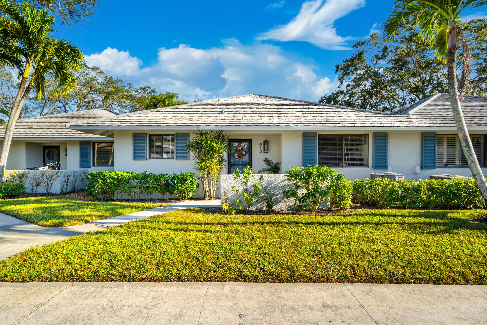 Tucked away in the prestigious PGA National community of Palm Beach Gardens, 913 Club Drive offers an exceptional opportunity for elevated living in one of the area's most desirable locations. This stunning lakefront home, featuring two bedrooms and two bathrooms, serves as a sanctuary for those seeking peace after a day of golfing, shopping at upscale boutiques, or enjoying the nearby beach.The expansive interior is filled with natural light, boasting soaring ceilings and a smooth transition between the dining and family rooms--perfect for both cozy gatherings and refined entertaining. Its prime location, just a short walk from the renowned resort and spa, offers easy access to a wealth of amenities and dining options, delivering a lifestyle marked by both convenience and luxury.