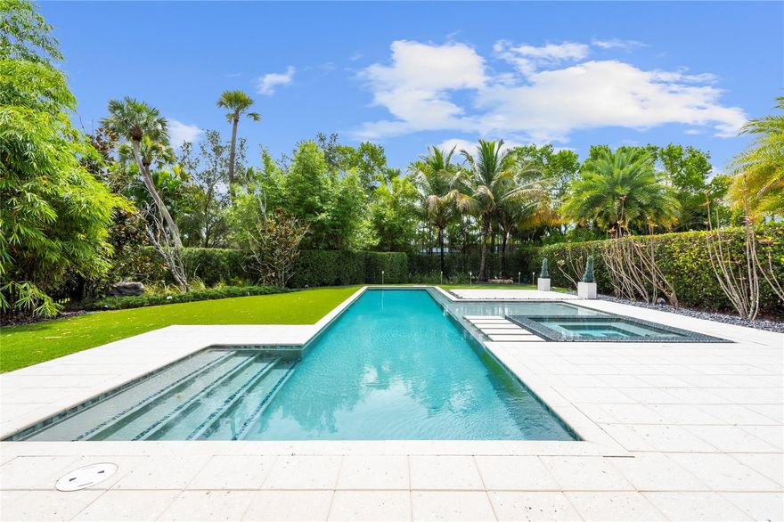 Gorgeous single story 3 bedroom 2 bath home w/custom pool/spa, putting green, circular driveway & large yard. Amazing upgrades inside & out. Contemporary kitchen w/white cabinets & SS appliances. Smart home that can control Movie Projector, motorized shades, etc through Alexa. Huge primary bedroom w/additional office area. Built-in bar & entertainment area in dining room. Impact glass, plantation shutters, Upgraded floors, custom cabinets, woodwork & window treatments throughout. Whole house generator. Garage epoxy floor, Tesla power charger, gorgeous outdoor backyard BBQ w/extended shaded area. Best location in Parkland Golf. Short walk to amenities. Parkland Golf offers true country club living w/fine dining, resort pools, fitness center, tennis, pickleball, championship golf & more!