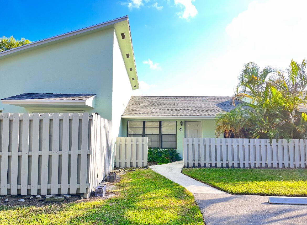 Coastal Treasure in Jupiter! Just minutes from the beach, this beautifully renovated 2 bed, 2 bath villa is the ultimate seaside retreat. Updated with modern finishes, new roof in 2021, and newer appliances. The wide kitchen features wood cabinetry and new refrigerator, while both baths are nicely redesigned. Enjoy serene indoor-outdoor living with tile and laminated flooring and a private fenced patio. Two assigned parking spots conveniently located in front of the unit. Easy access to I-95 and Turnpike, close to restaurants and stores. A move-in-ready, beach-close gem--schedule your tour now before it's gone!