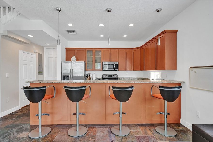 Ready for you to move in and enjoy! This spacious end-unit townhome offers privacy and coastal convenience in a small community of just five residences. Just  moments from the beach, this rarely available townhome is close to everything happening in Pompano Beach!The light, open and clean layout works great for everyday living. And because it’s an end unit, you get extra windows and more natural light, which makes it feel even more open.The two-car garage means plenty of storage space, and the low HOA covers landscaping along with shared windstorm, hazard, and flood insurance.You’re close to the beach, restaurants, and everything happening throughout Pompano Beach — but when you’re home, it feels quiet and tucked away.Enjoy the beachside lifestyle you've always wanted!