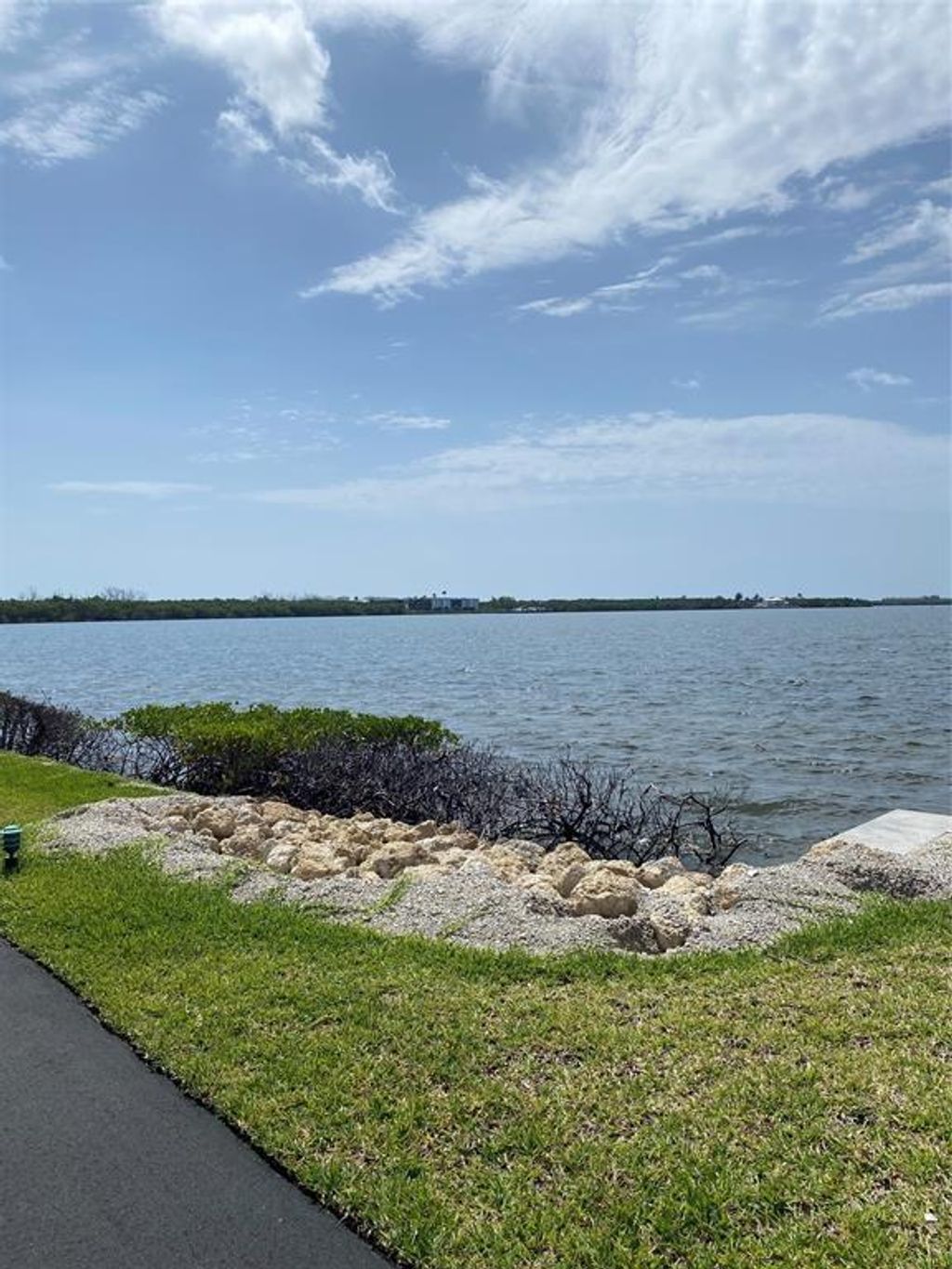 Photo of 3432 NE Causeway Blvd #102, Jensen Beach, FL 34957 (MLS # F10457672)