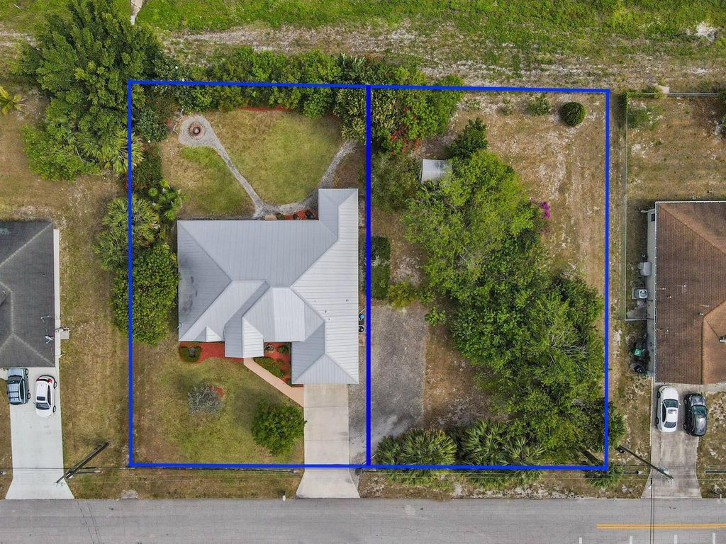 Photo of 901 SW Idol Avenue, Port Saint Lucie, FL 34953 (MLS # R11083857)