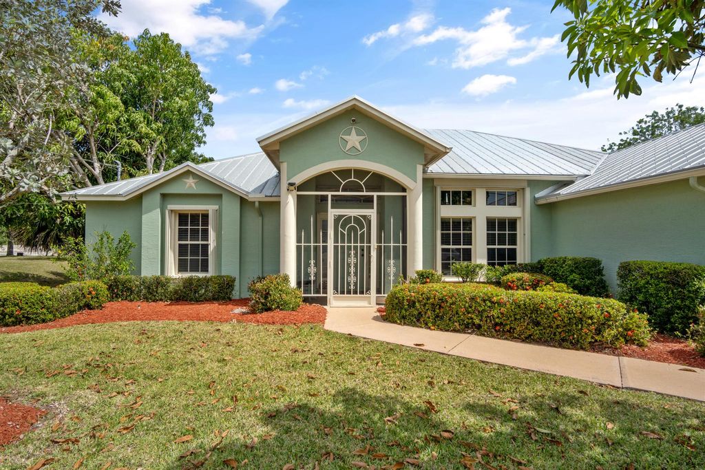 Photo of 901 SW Idol Avenue, Port Saint Lucie, FL 34953 (MLS # R11083857)