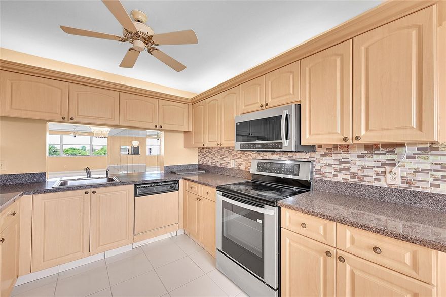 55+ Community, Building 190, unit 403, Phase IV, top floor, Riviera model in the Islands, with separate large laundry room and an updated kitchen, carpet and tile.  Enjoy the great water views from extended FLA room giving you more living space.  Updated kitchen and bathroom.  Newer A/C  55+ COMMUNITY WITH A MAIN CLUBHOUSE, SAUNAS, BBQ, PICNIC AREAS, BILLIARDS, THEATER, CABANAS, COURTESY BUSSES TO STORES AND SAWGRASS MILLS MALL, INDOOR AND OUTDOOR POOLS AND FITNESS ROOM IN THE SOUGHT AFTER SUNRISE LAKES PHASE IV.